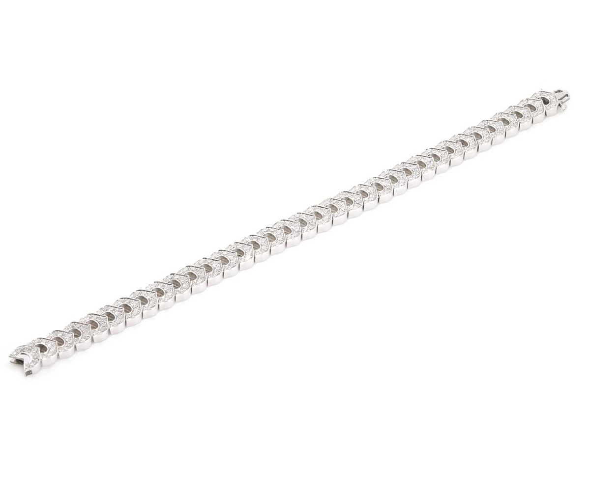 An 18ct white gold C de Cartier diamond line bracelet (Sold for £16,900)